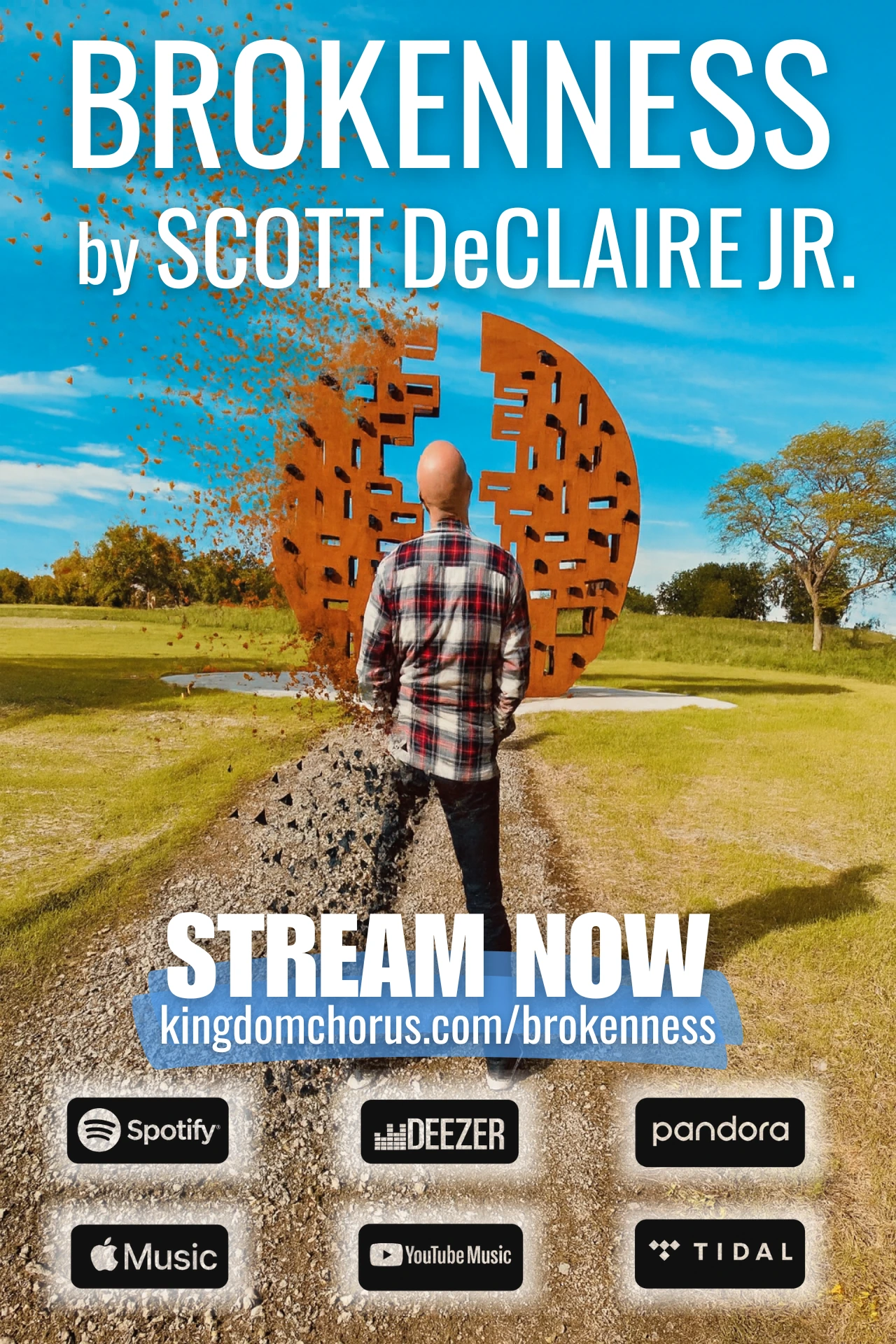 A man standing on a gravel path facing a large broken circular sculpture, with pieces of his silhouette breaking apart into fragments under a bright blue sky.